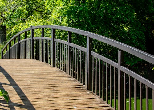 Wooden Arch Bridge Over a River 