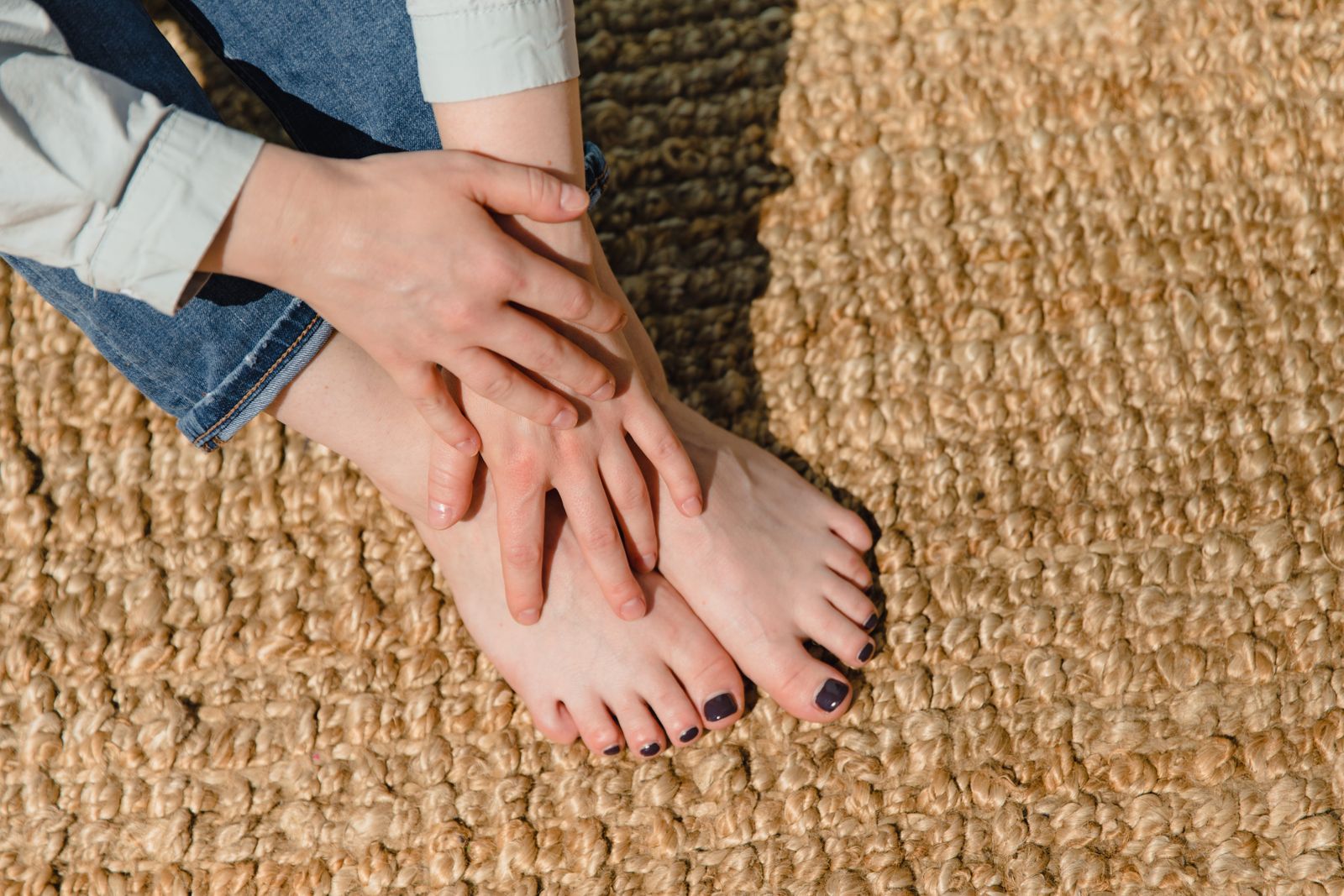 Person walking outdoors on a bright path with visible ankle support context