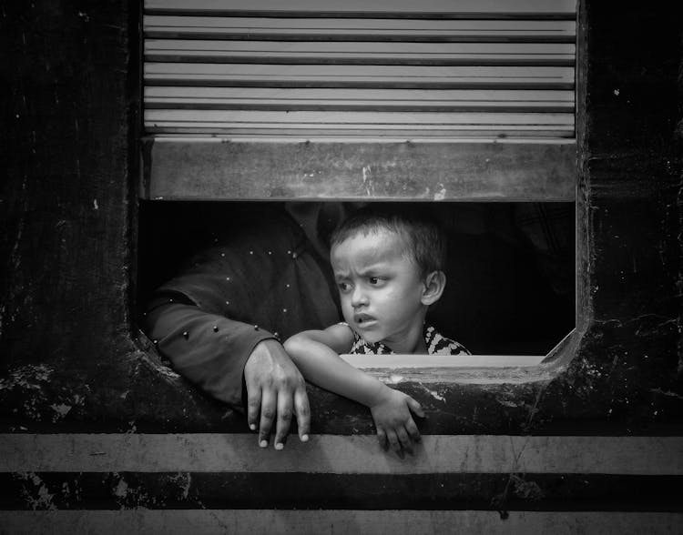 Child Face Behind Window