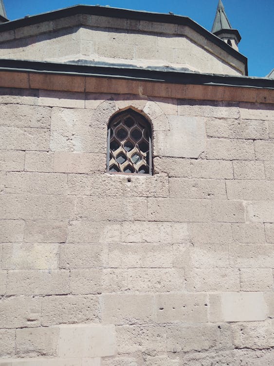 A Grille Window On Concrete Wall