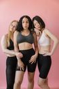 3 Women in White Tank Top and Black Leggings