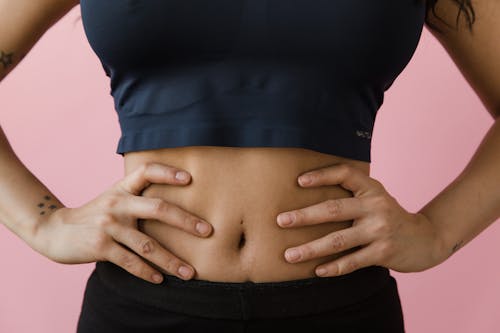 A Woman Hands on Her Belly