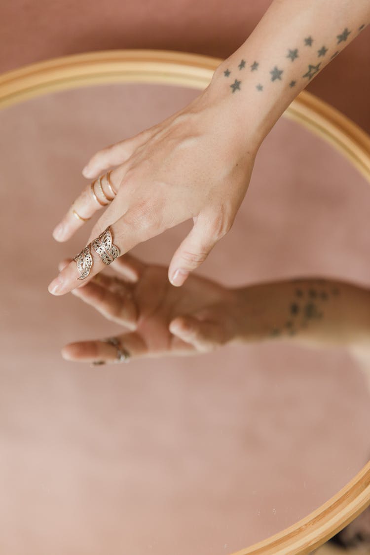 Person Touching A Mirror