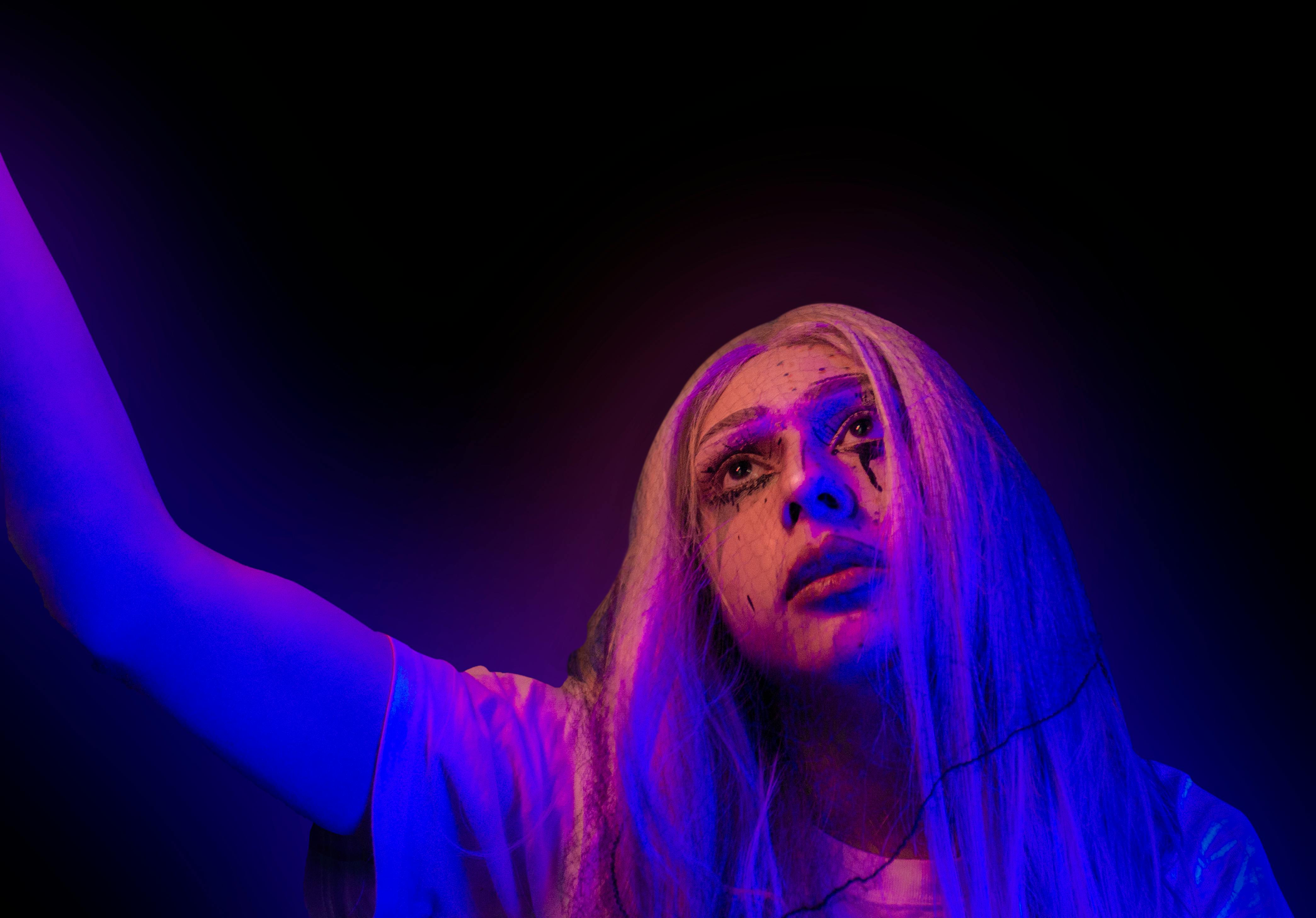 A Woman Smearing Makeup While Crying · Free Stock Photo