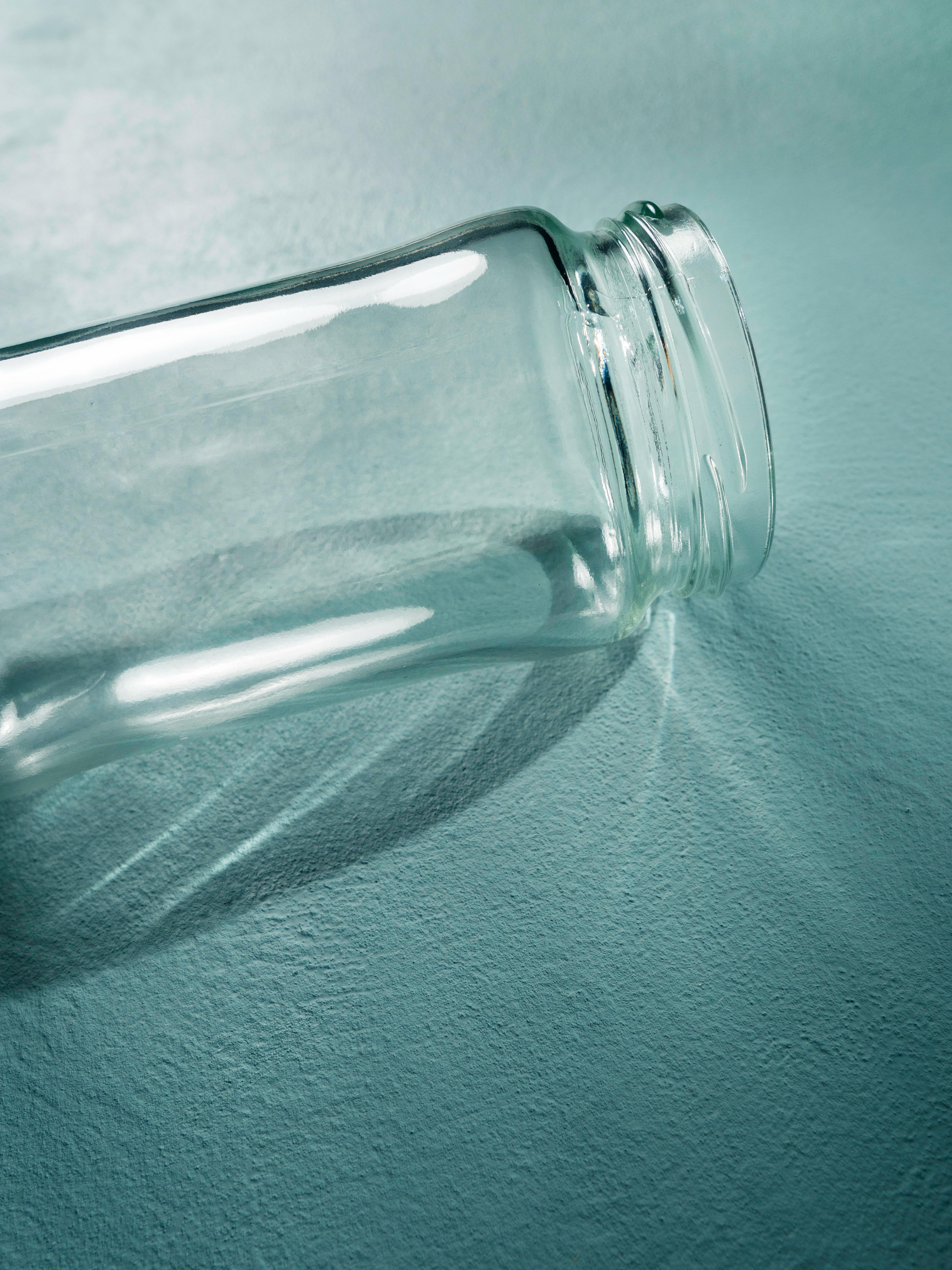 empty glass bottle on side
