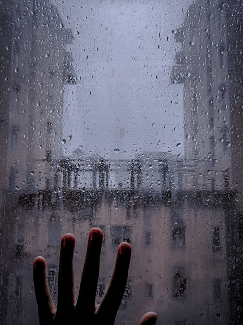 Free stock photo of hands on window, raindrops, stranded Stock Photo