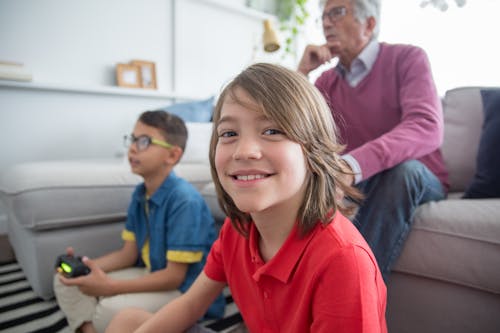 Grandfather and Children Playing a Video Game 