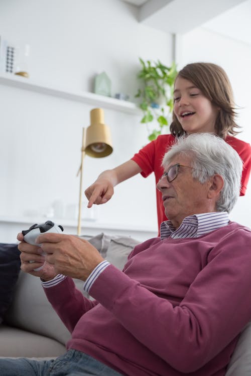 Elderly Man Holding a Game Controller