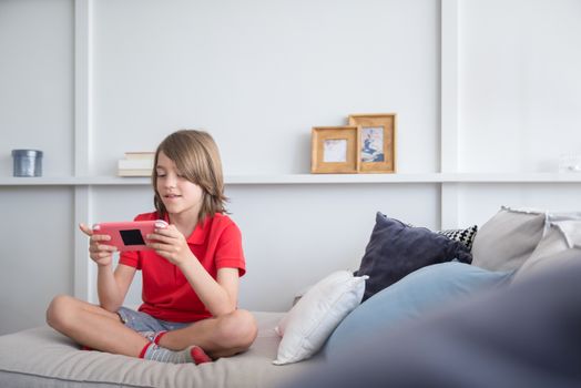 Girl in Pink T-shirt Sitting on Bed
