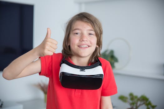 Happy child in red shirt giving thumbs up with VR goggles at home, enjoying virtual reality.