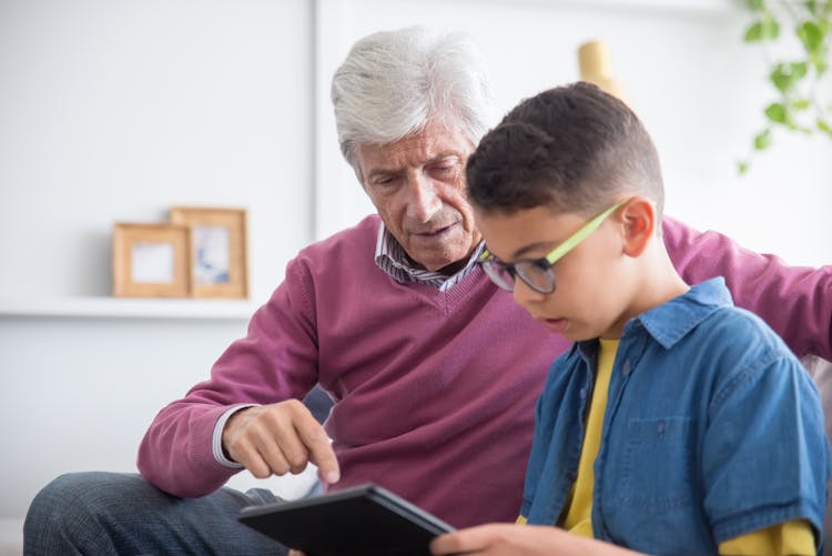 Grandfather Caring For His Grandson