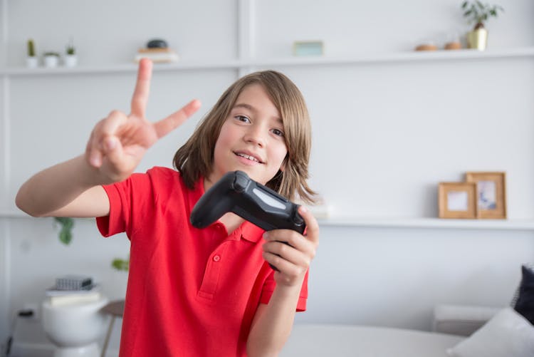 Kid Holding A Video Game Controller