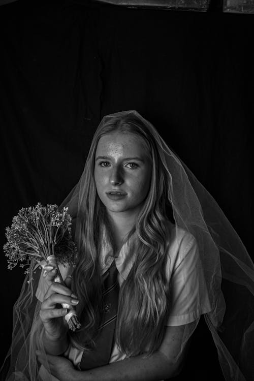 A Woman holding a Wedding Bouquet