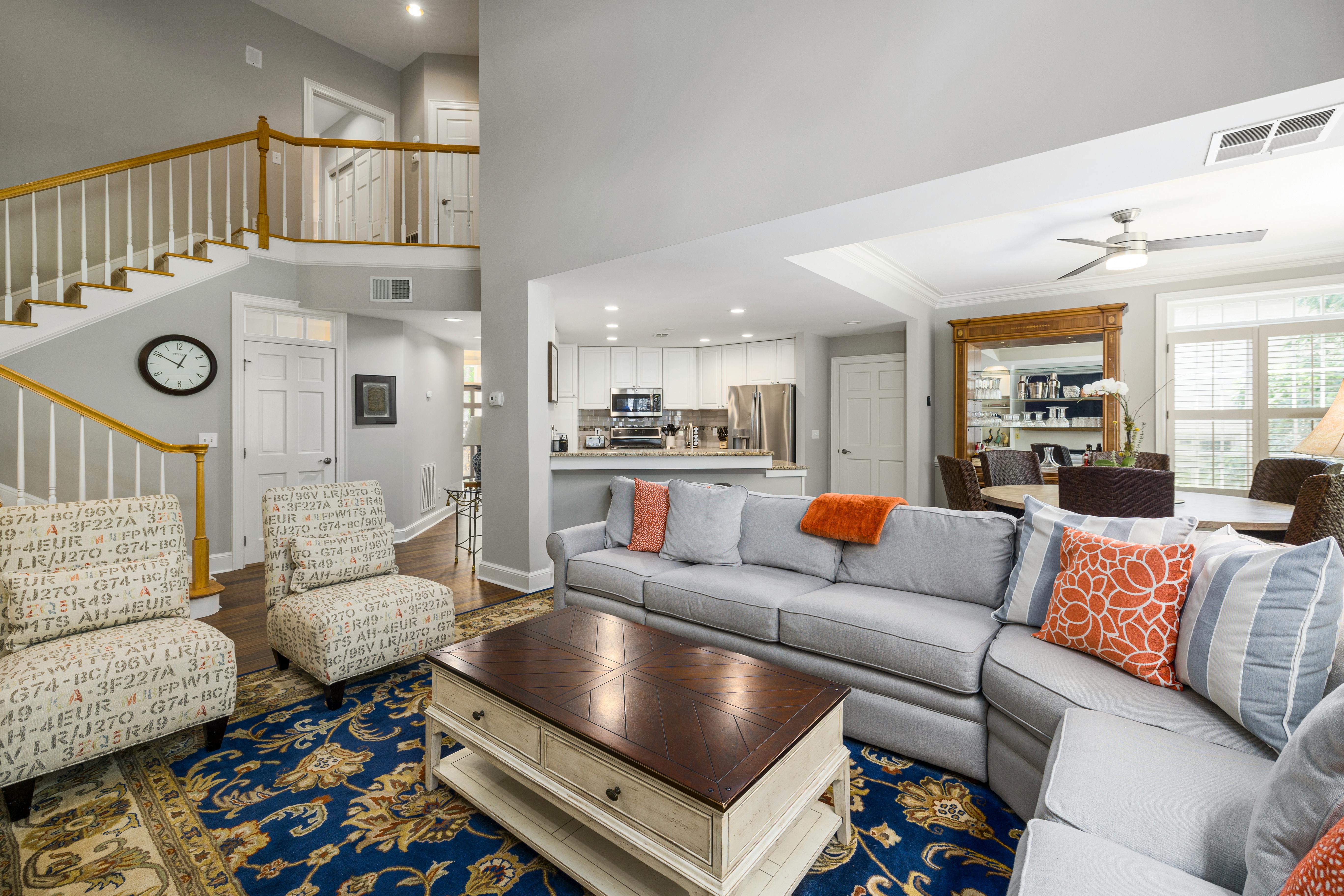 Contemporary Living Room and Kitchen Design with a Colorful Rug · Free