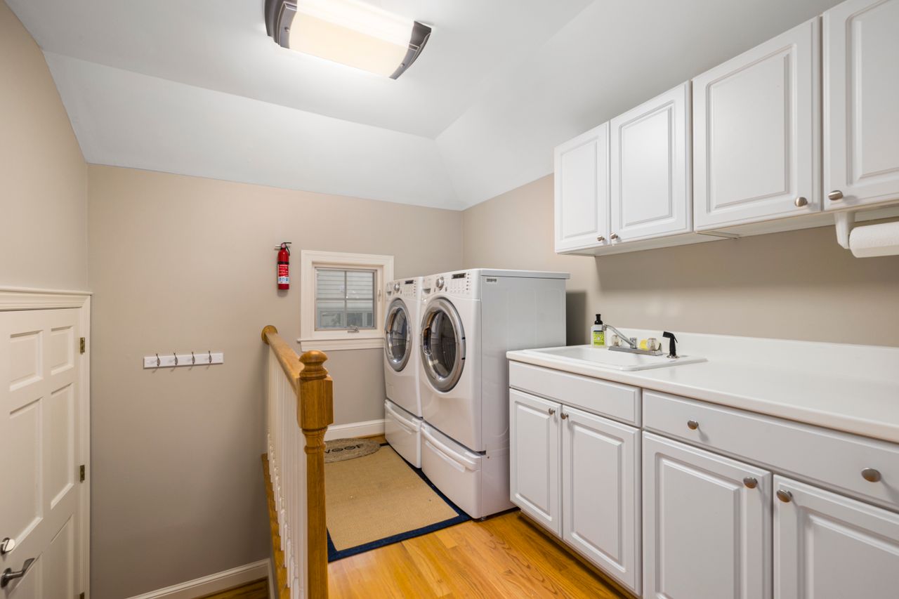 A utility sink set into a cabinet