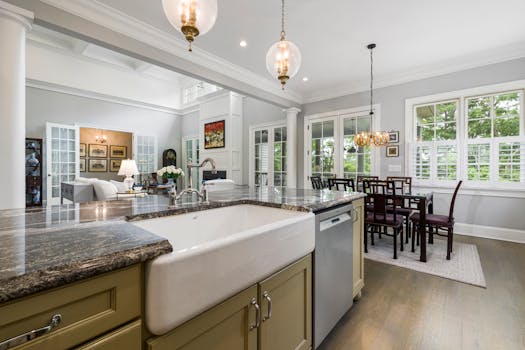 Elegant open space kitchen and dining room with a modern design and beautiful lighting.