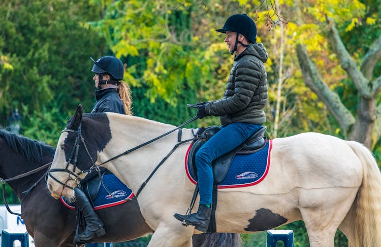 Man And Woman Riding Horses