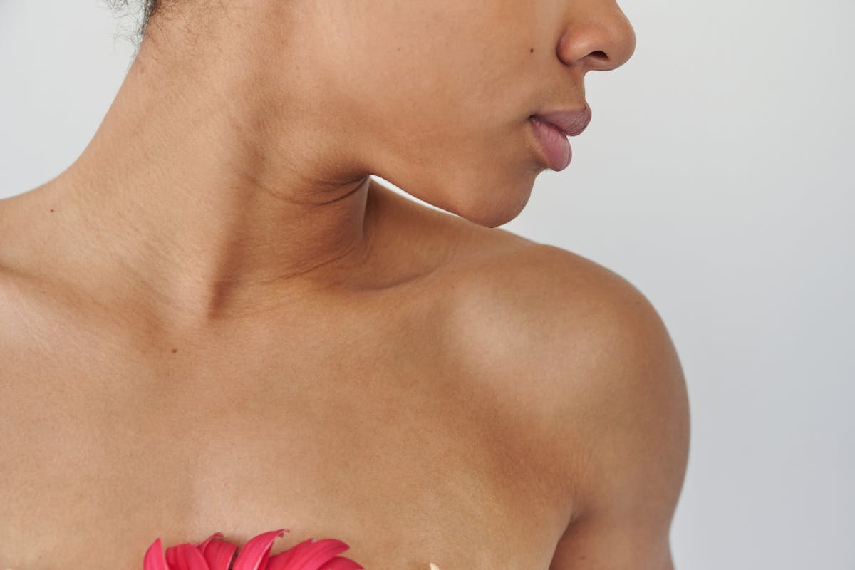 A veterinarian or herpetologist examining a snake in a clinical setting