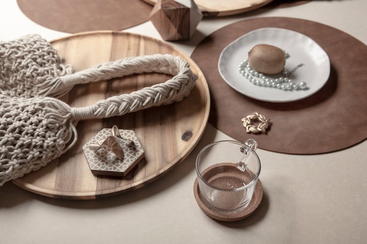 A Glass, Table Pads, Wooden Tray And Ornaments 