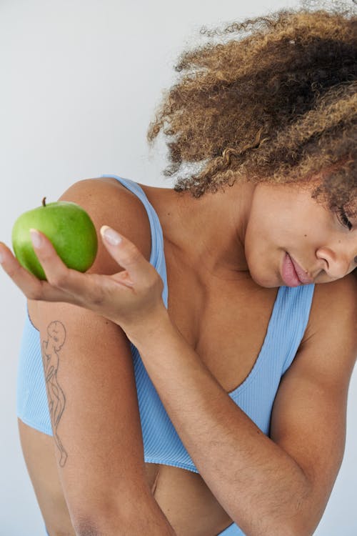 Woman Holding an Apple 