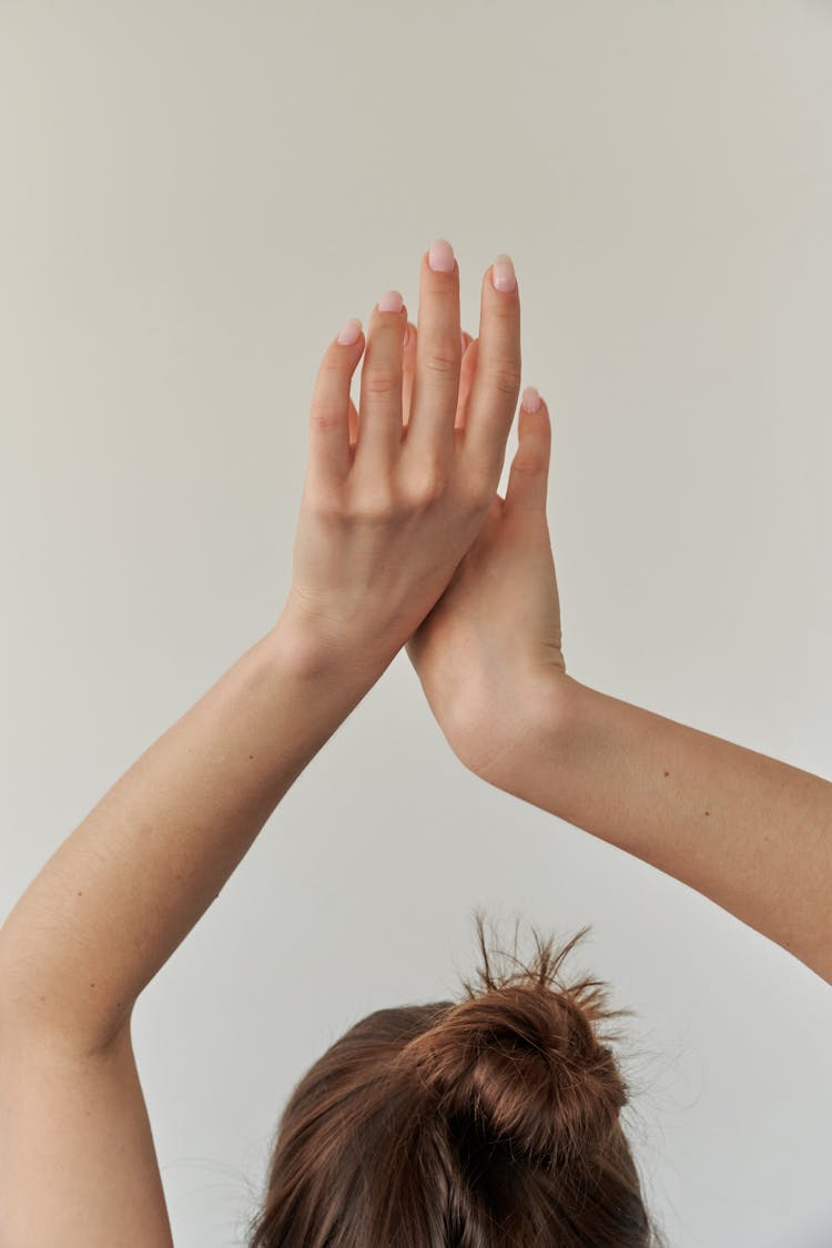 Woman Raising Her Arms Above Head