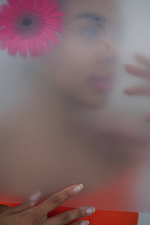 Abstract Photo of Woman Behind Glass