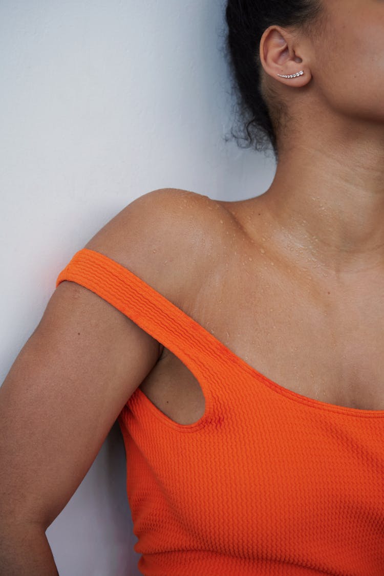 Close Up Of Orange Clothes On Woman