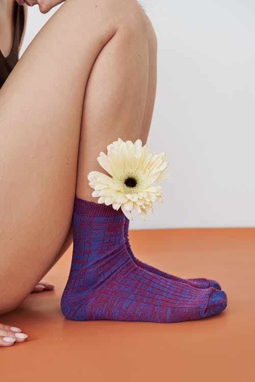 Flower in a Sock on a Womans Foot