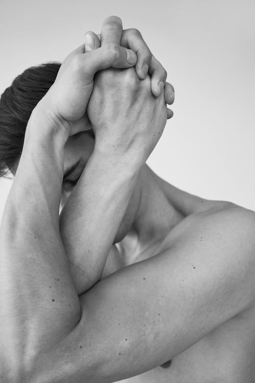 Free Grayscale Photo of Topless Woman Covering Her Face Stock Photo
