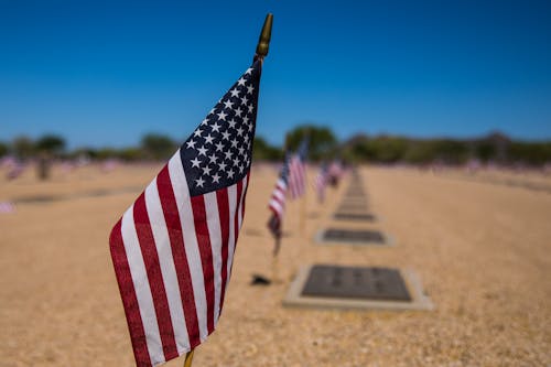 Free Us a Flag on Brown Concrete Floor Stock Photo