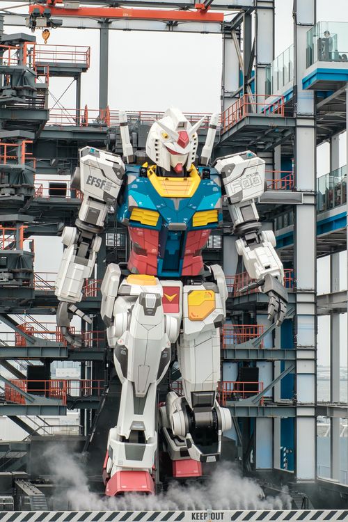 Free Massive robot in an industrial area, showcasing advanced technology and engineering. Stock Photo