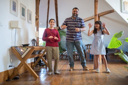 A Father Dancing with his Children