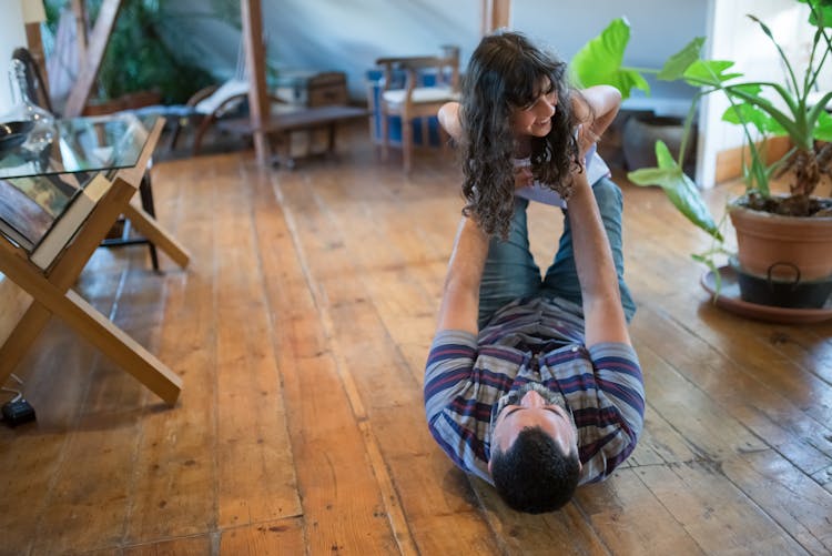 A Father And Daughter Playing Together