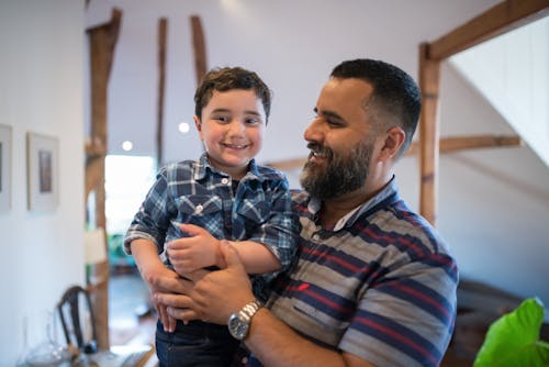 Man Carrying a Boy