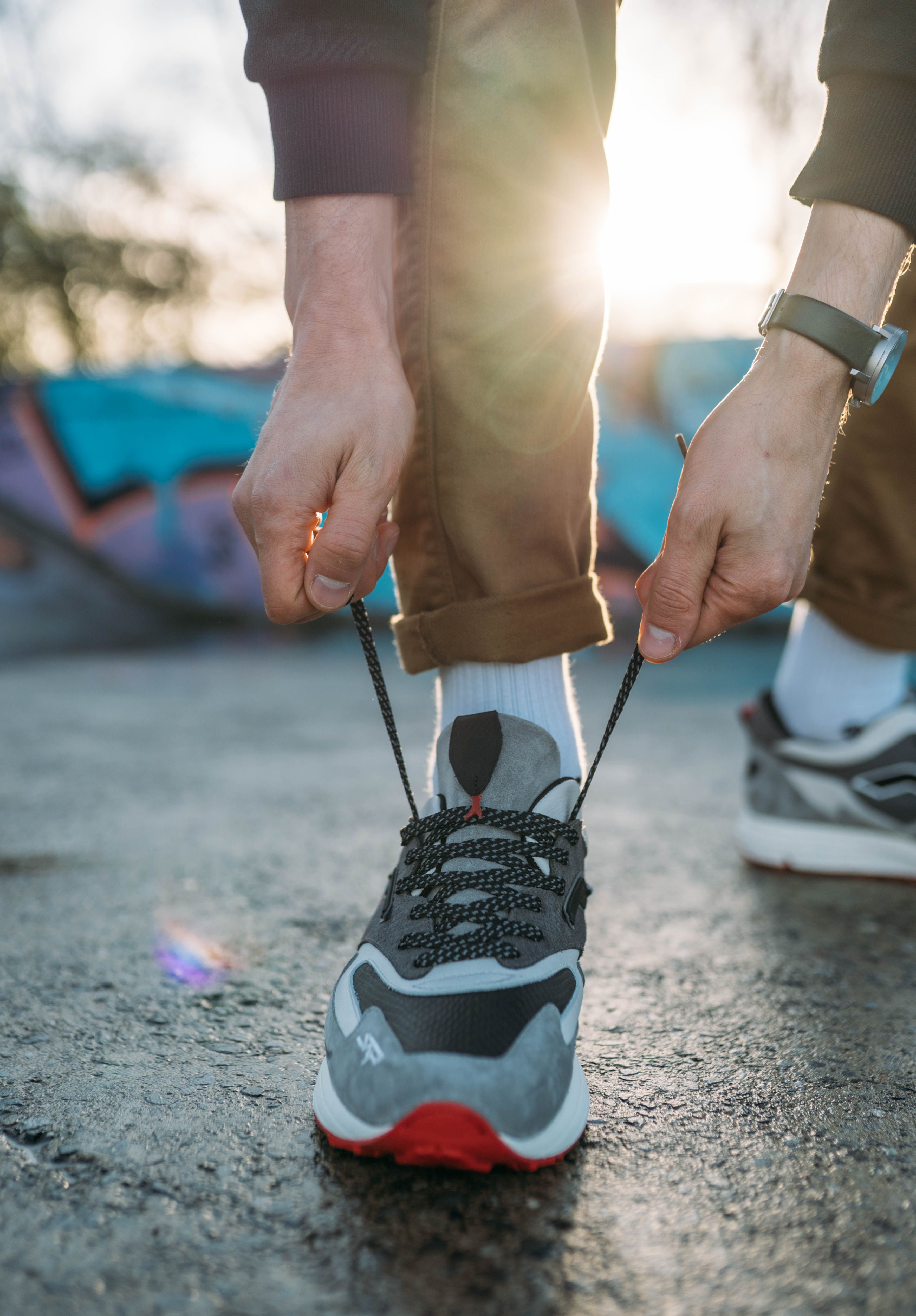 Woman Hands Tying Shoe · Free Stock Photo