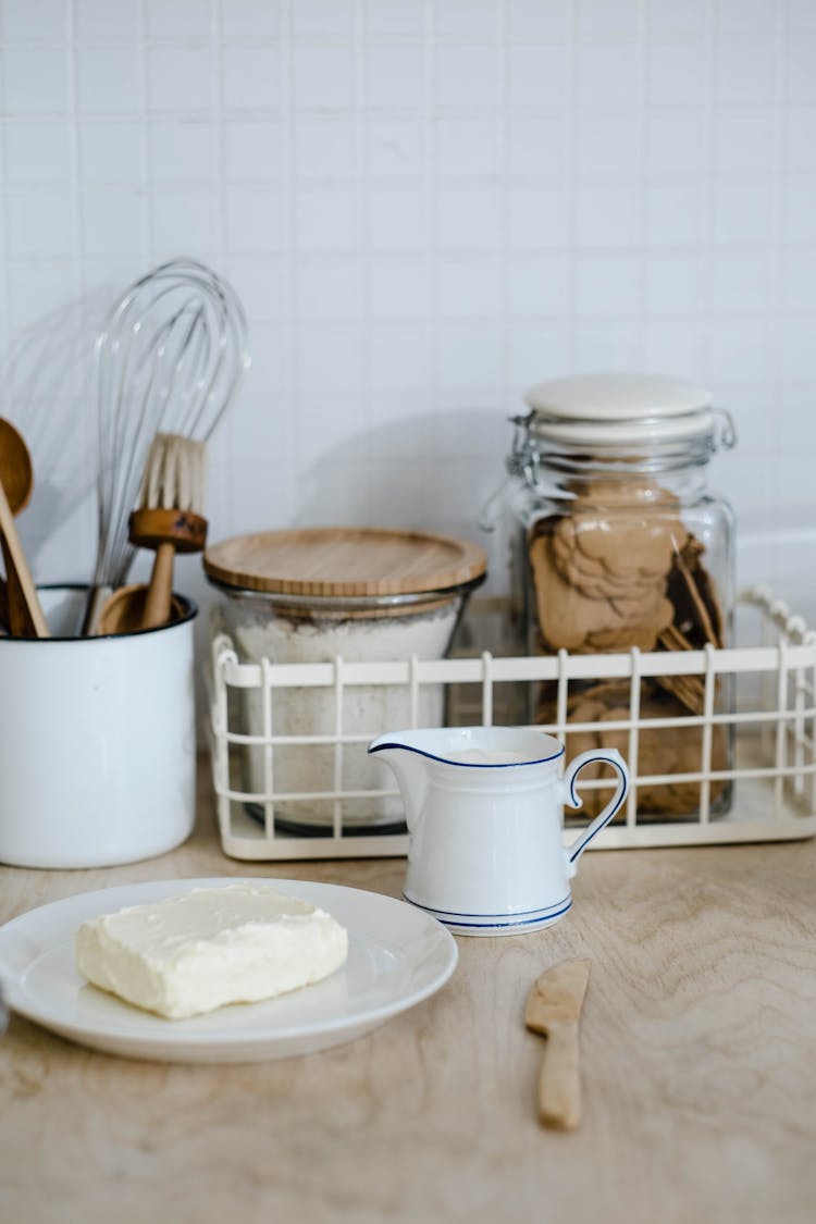 White Cream Cheese Beside A Milk Dispenser