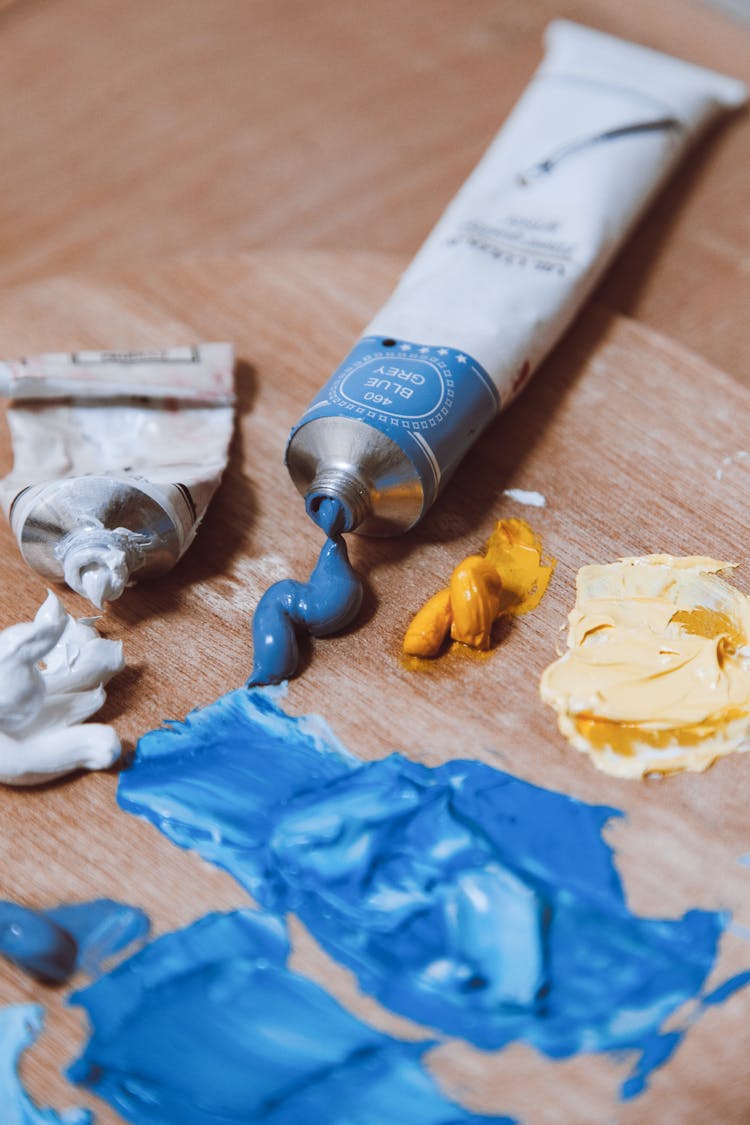 Close Up Of Blue Paint On A Wooden Palette