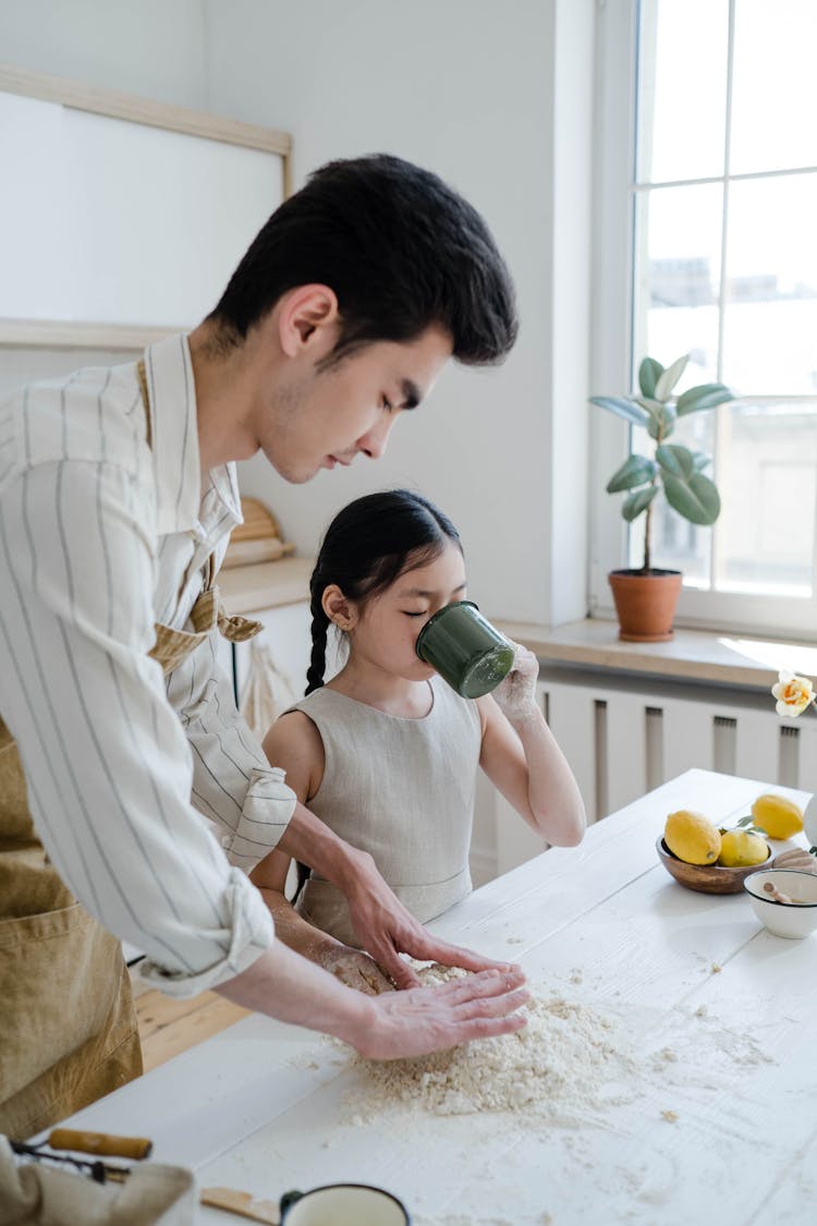 A Man Baking With His Daughter