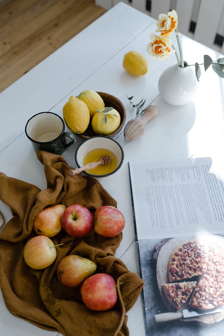 Fresh Fruits And Cookbook On The Table