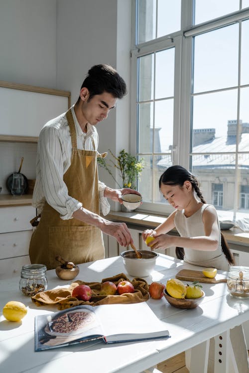 Free A Man Baking with his Daughter Stock Photo