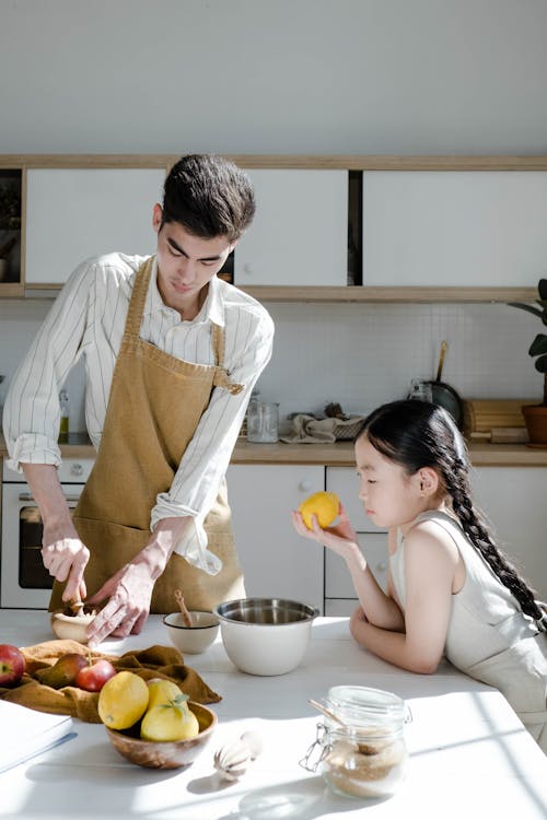 Free A Man Cooking with his Daughter Stock Photo