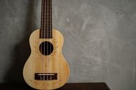 Brown Acoustic Guitar on Gray Textile