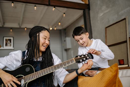 Man in White Dress Shirt Playing Acoustic Guitar
