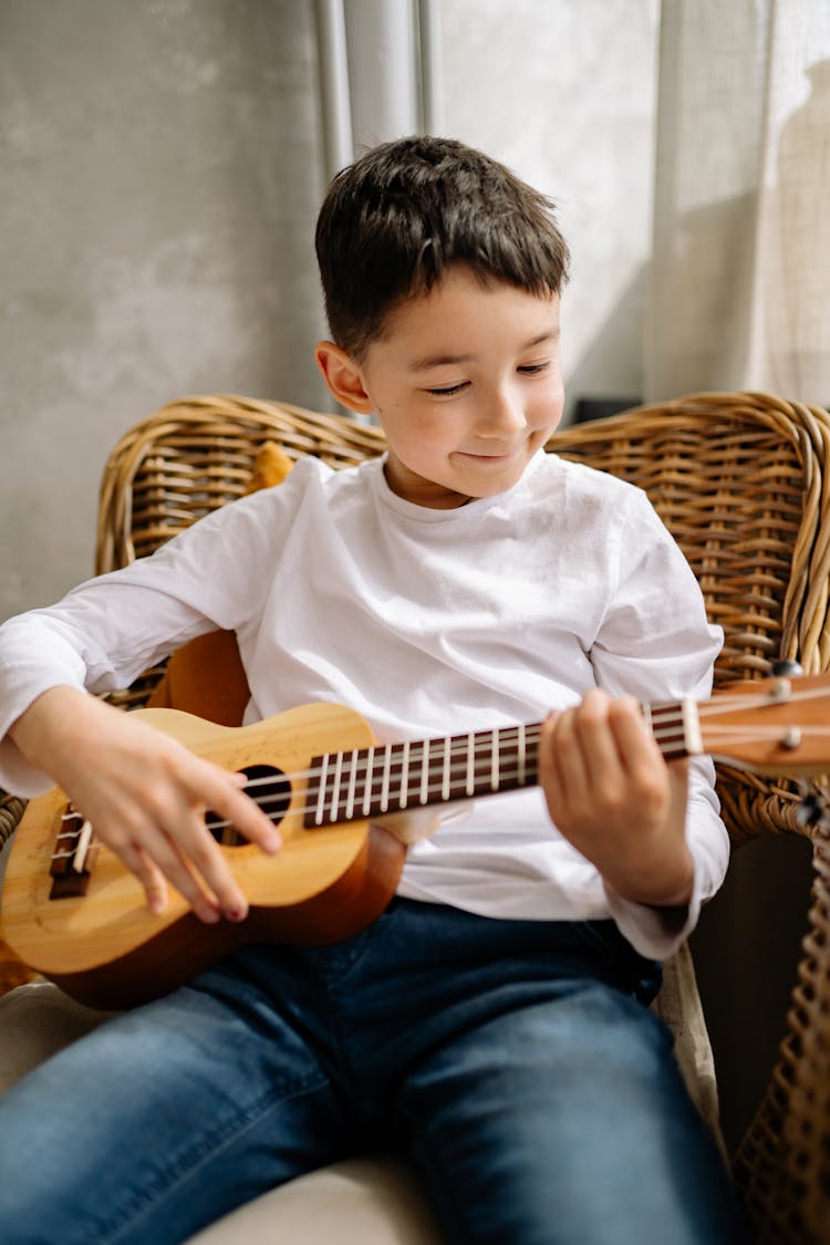 A Boy Playing Ukulele