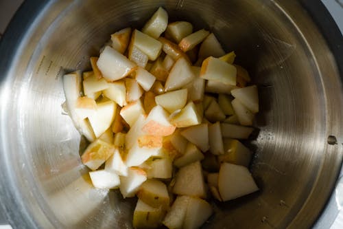 Free Close-Up Shot of Slices of Apples in a Stainless Bowl Stock Photo
