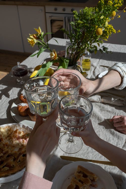 People Toasting Clear Drinking Glasses