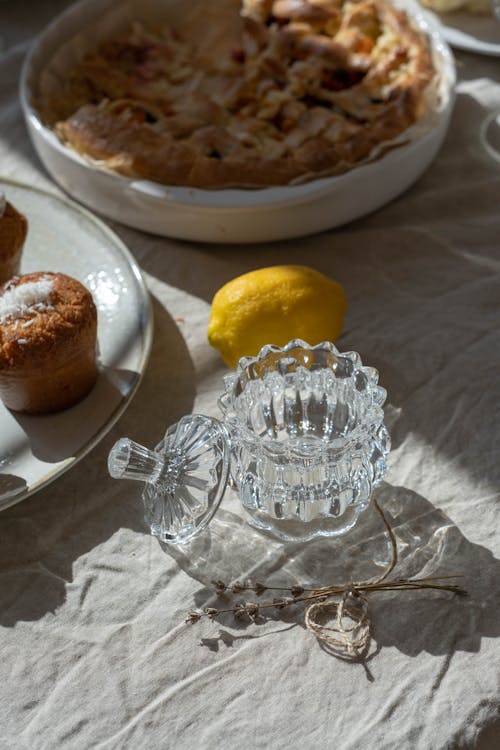 Dried Flowers and Glass Container on the Table