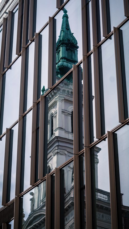 Building Reflection On Glass Panel Windows