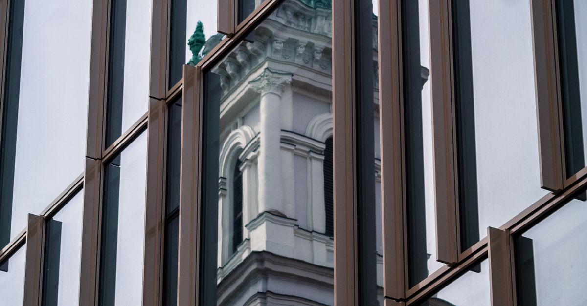 Building Reflection On Glass Panel Windows · Free Stock Photo