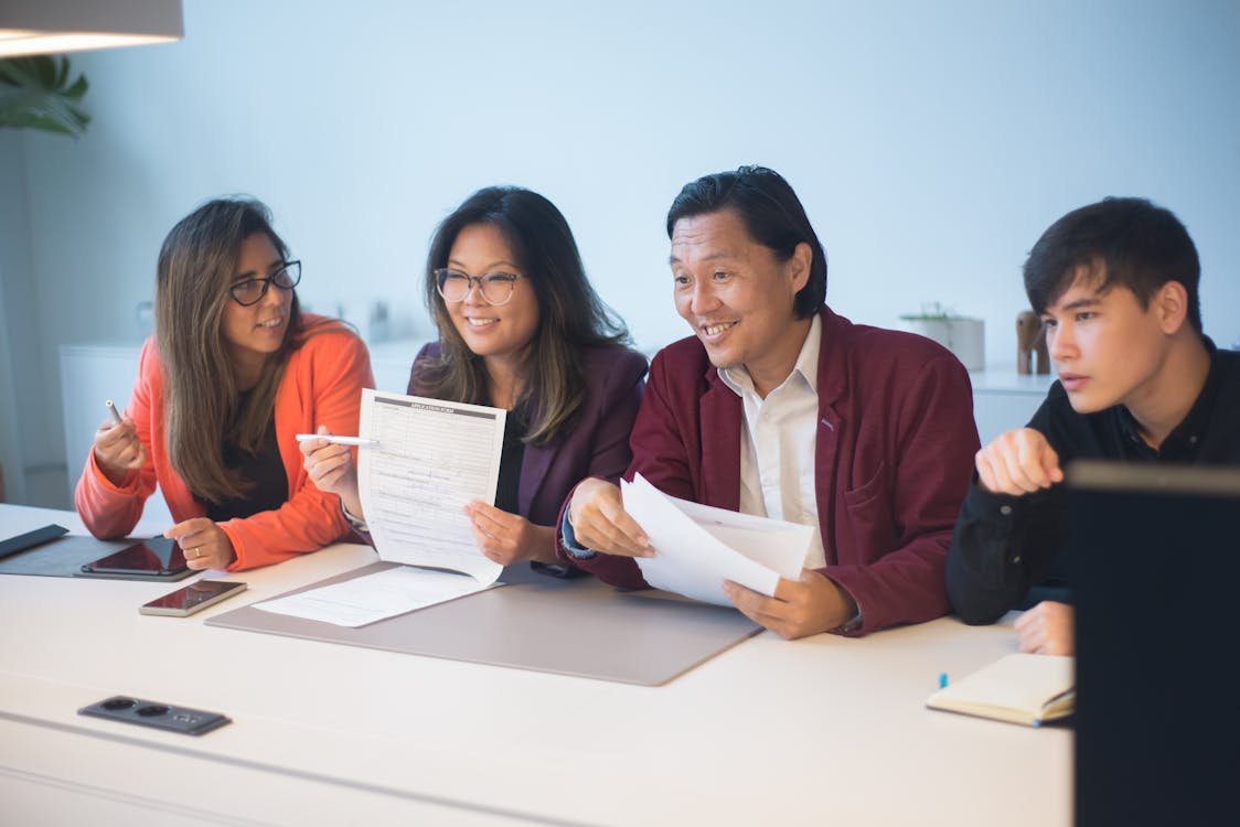 Free 2 Women and Man Sitting at Table Stock Photo